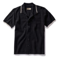 flatlay of The Button Down Polo in Coal Herringbone