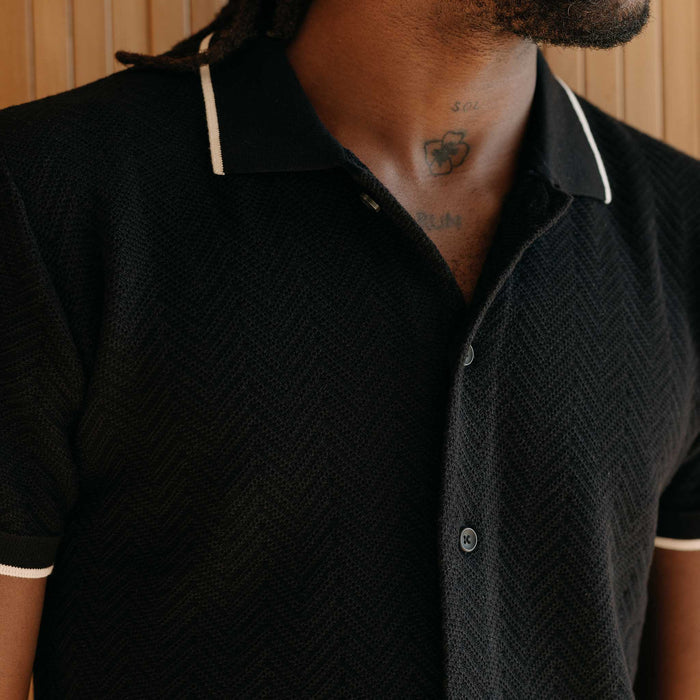 fit model showing off the collar on The Button Down Polo in Coal Herringbone