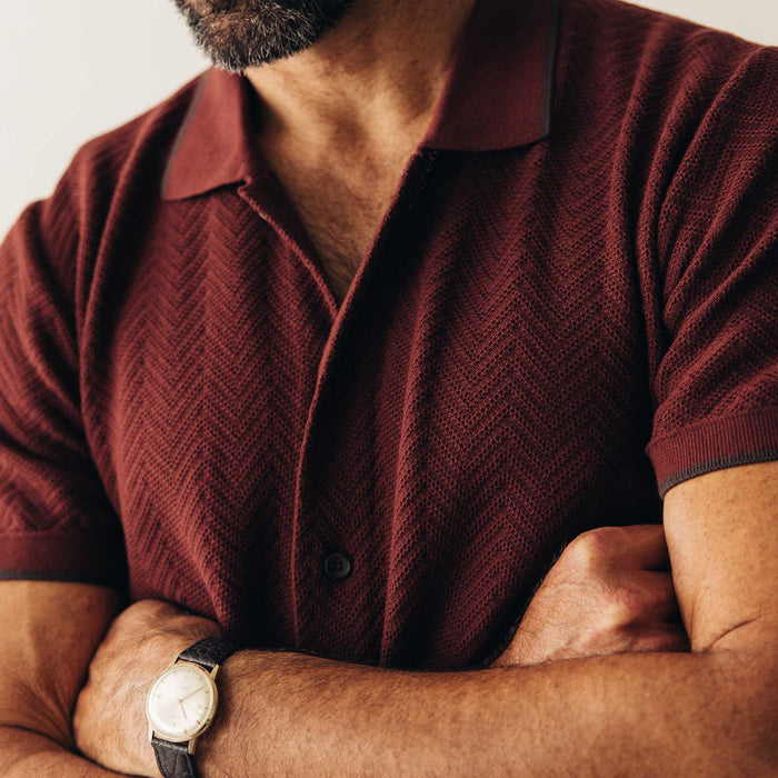 fit model showing off texture on The Button Down Polo in Dried Cherry Herringbone
