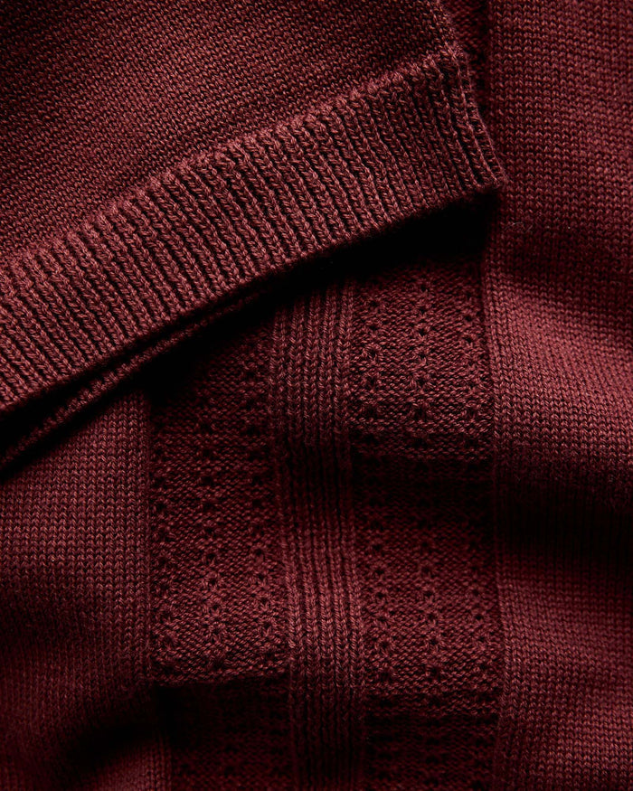material shot of the sleeves on The Button Down Polo in Dried Cherry Stripe