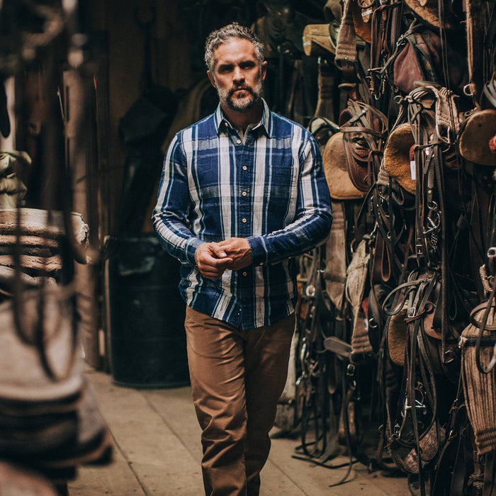 fit model wearing The California in Indigo Plaid, in horse stable
