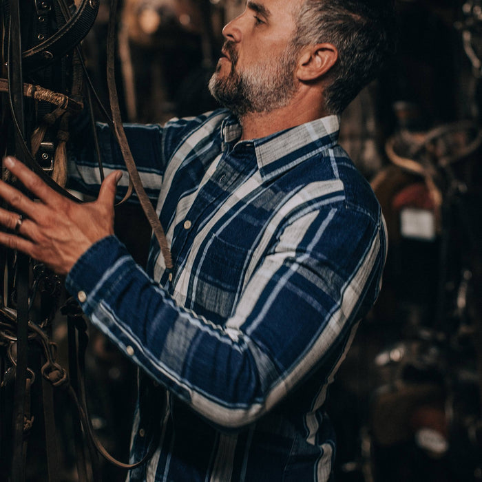 fit model wearing The California in Indigo Plaid, working in stable