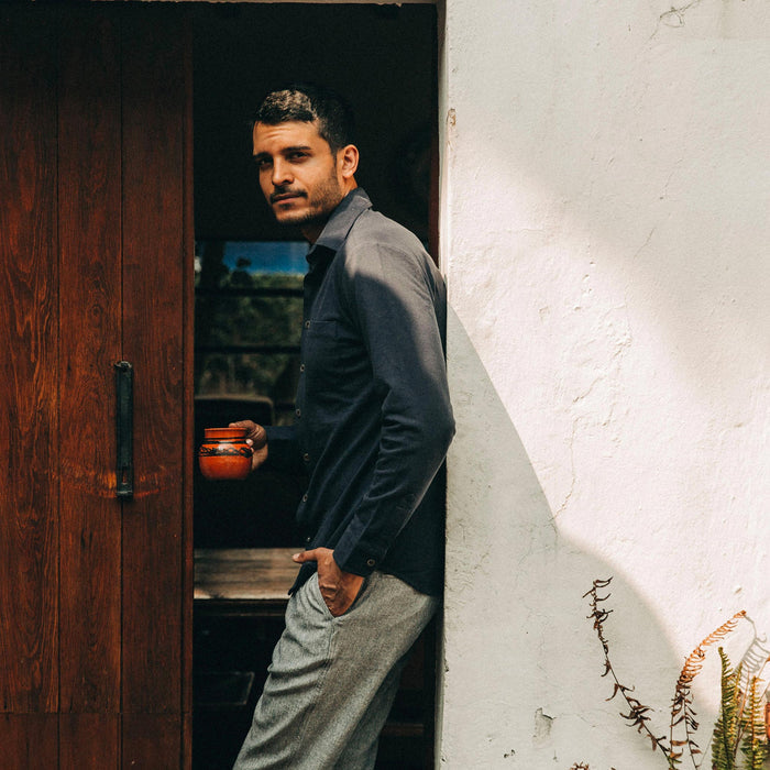 fit model wearing The California in Navy Pique, leaning against wall
