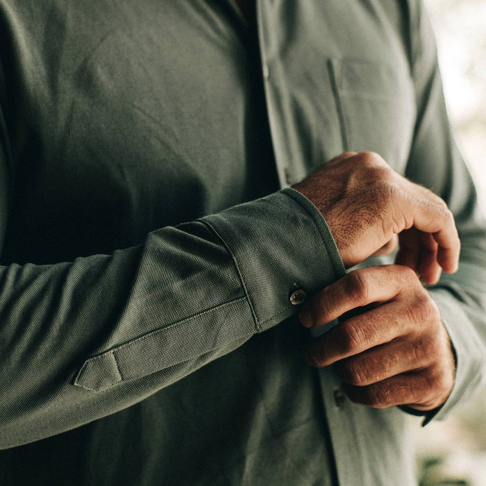 fit model wearing The California in Sea Green Pique, sleeve button detail