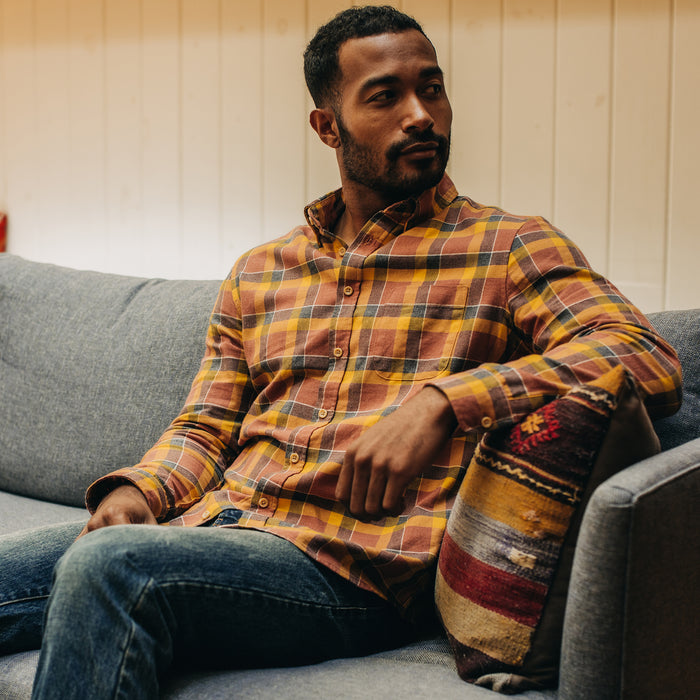 fit model sitting wearing The California in Trolley Plaid