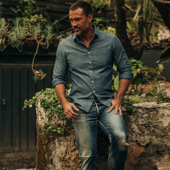 fit model wearing The California in Washed Indigo Crepe, sitting on rock