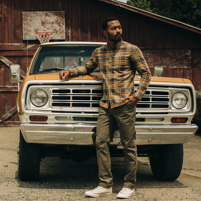 fit model standing by a truck wearing The California in Zephyr Plaid