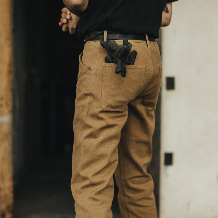 Our fit model wearing The Camp Pant in British Khaki Tuff Duck from Taylor Stitch.