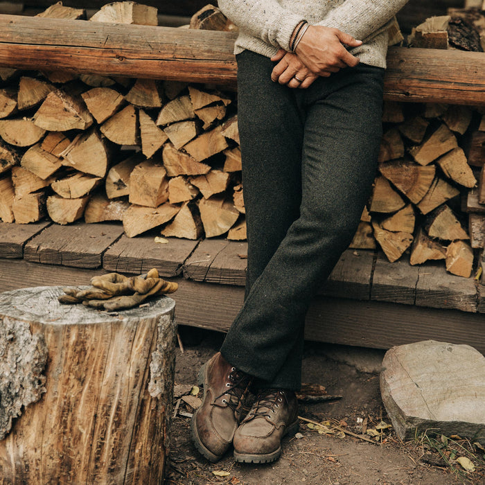 fit model wearing The Camp Pant in Dark Moss Wool, standing outside