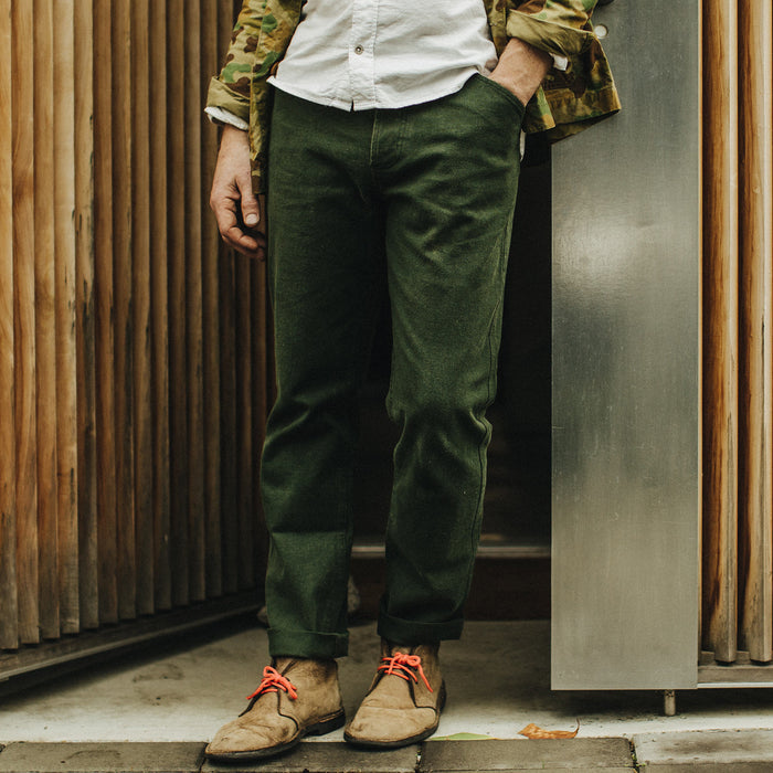 Our fit model wearing The Camp Pant in Dark Olive Tuff Duck from Taylor Stitch.