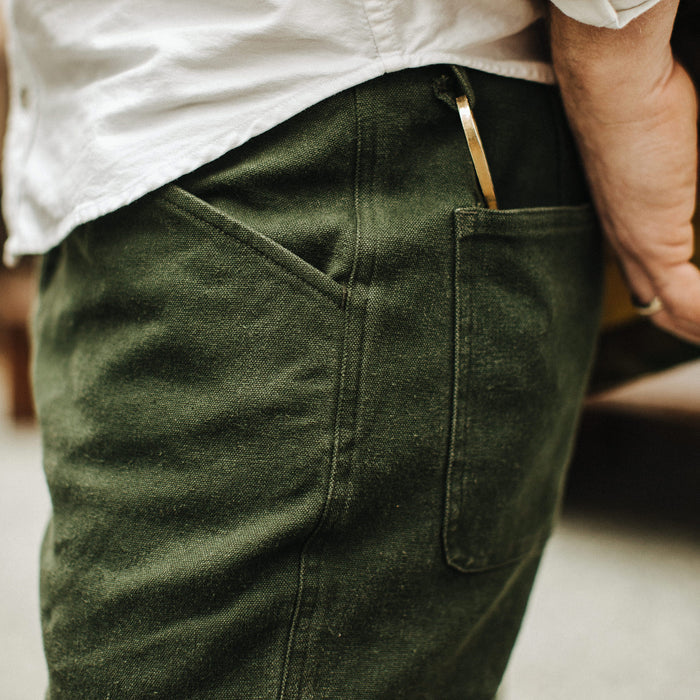 Our fit model wearing The Camp Pant in Dark Olive Tuff Duck from Taylor Stitch.