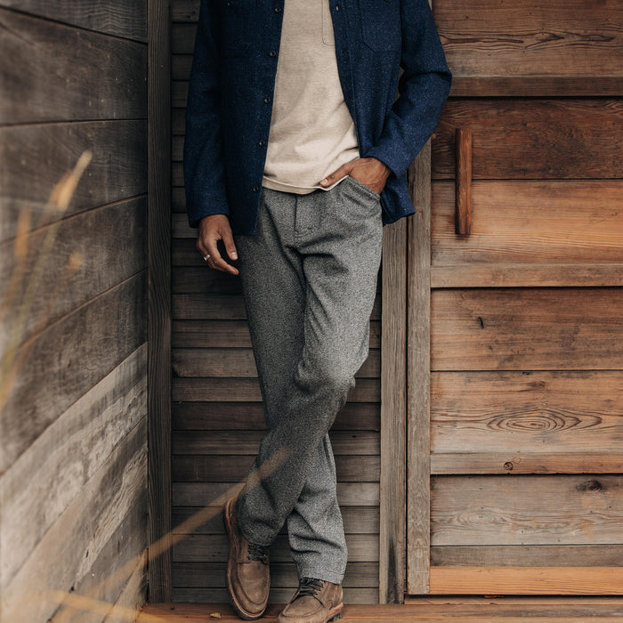 fit model leaning against the wall in The Camp Pant in Indigo Salt and Pepper