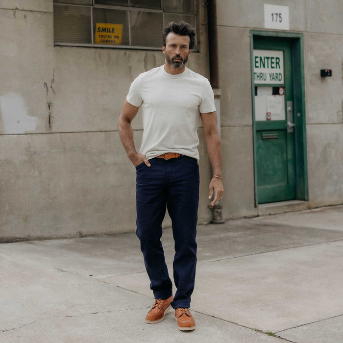 fit model with his hand in his pocket wearing The Camp Pant in Rigid Indigo Sashiko