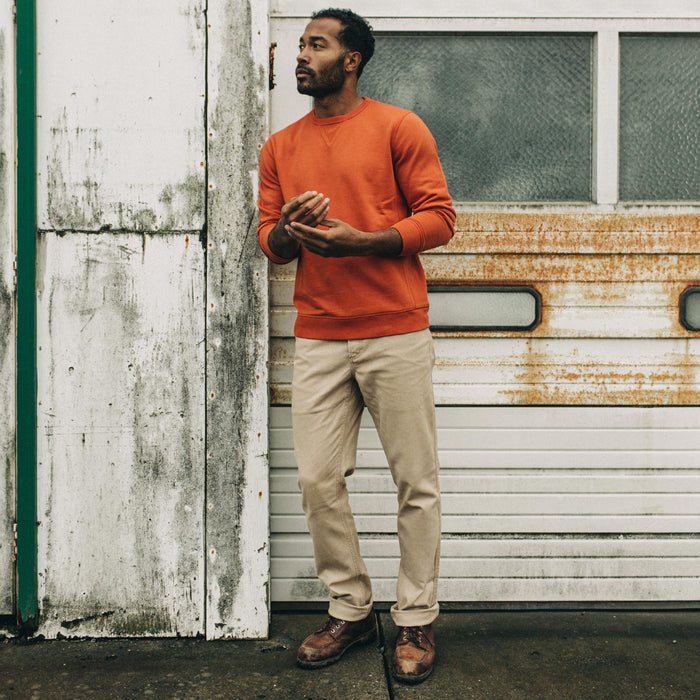 fit model standing by a garage door in The Camp Pant in Sand Boss Duck