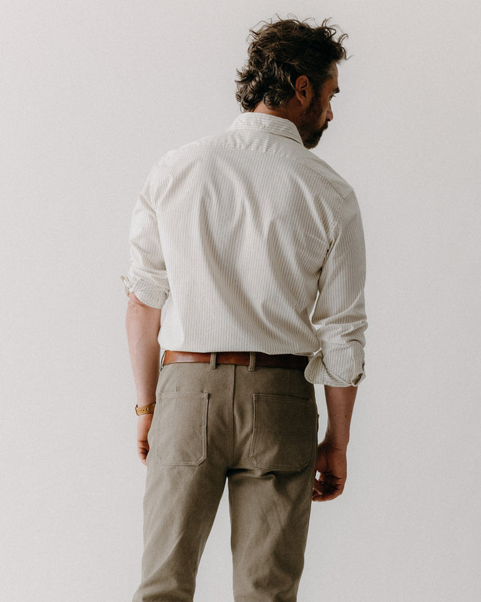 fit model showing off the back of The Camp Pant in Stone Chipped Canvas