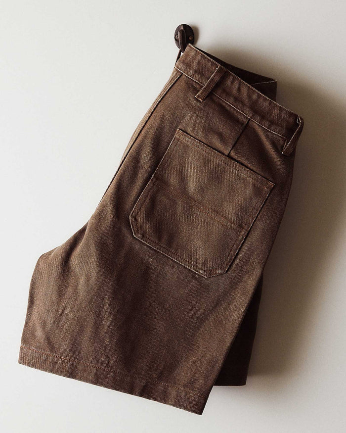editorial image of The Camp Short in Aged Penny Chipped Canvas hanging
