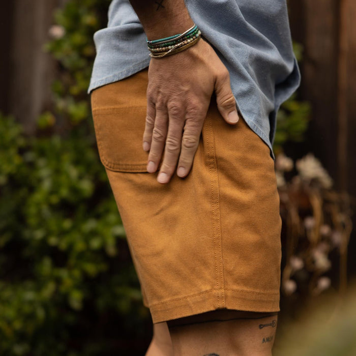 fit model showing the side of The Camp Short in Cedar Boss Duck