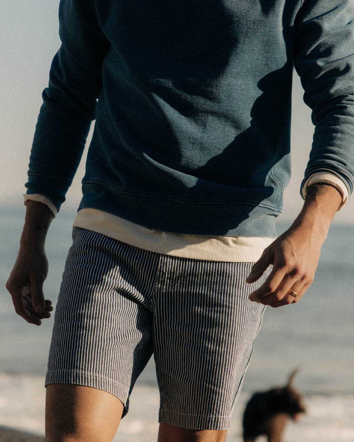 fit model showing off The Camp Short in Indigo Railroad Stripe Denim