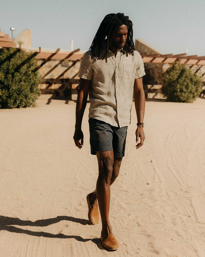 fit model walking wearing The Camp Short in Navy Chipped Canvas