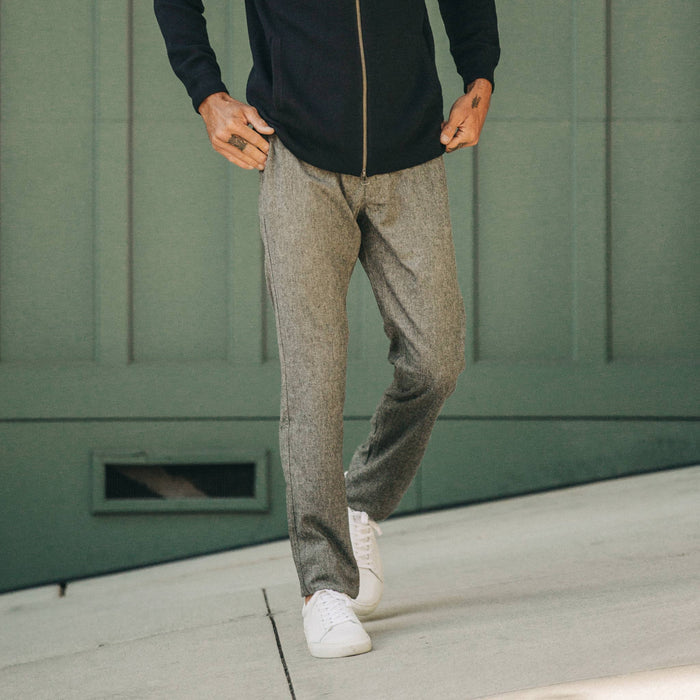 fit model wearing The Carmel Pant in Charcoal Birdseye Wool, hand going into pocket