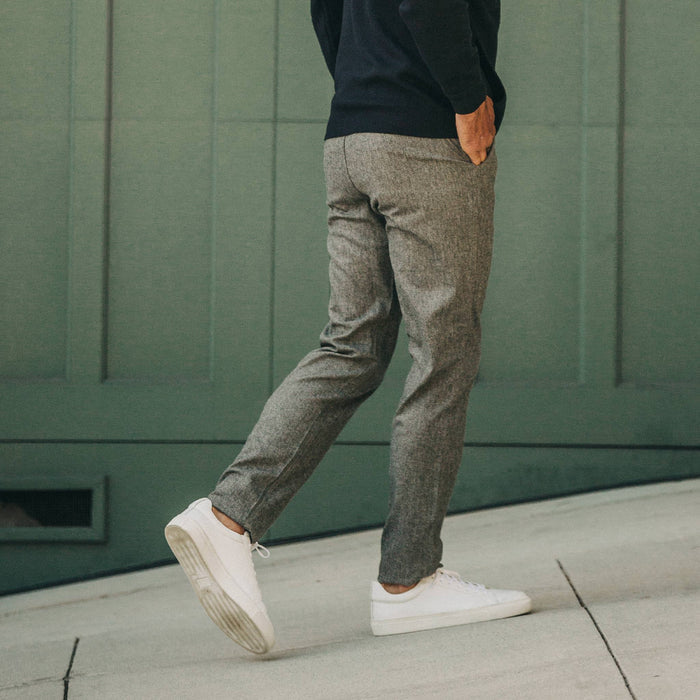 fit model wearing The Carmel Pant in Charcoal Birdseye Wool, walking right