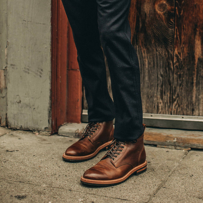 fit model wearing The Carmel Pant in Navy Wool, with brown boots
