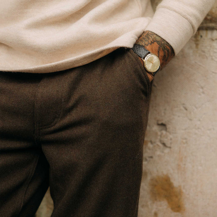 fit model with his hand in the pocket of The Carnegie Pant in Army Herringbone Wool