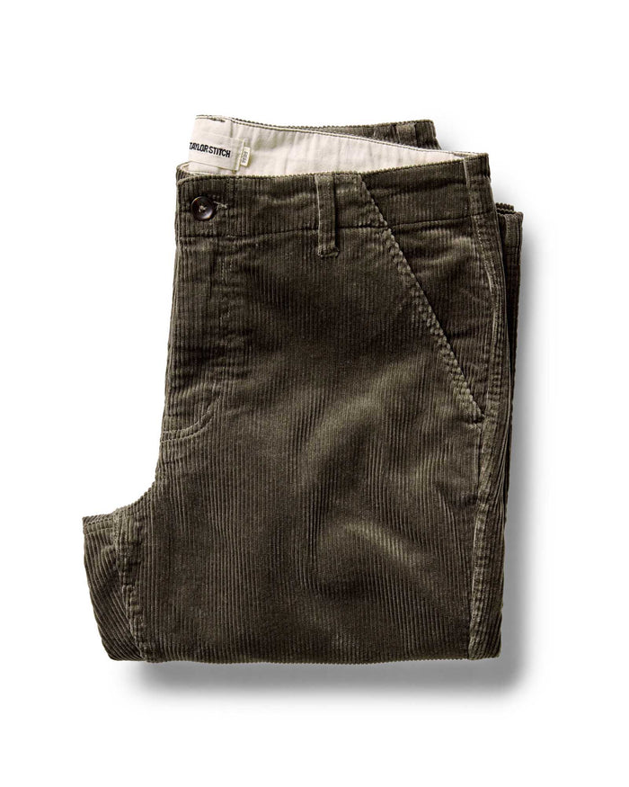 folded flatlay of The Carnegie Pant in Fatigue Olive Corduroy