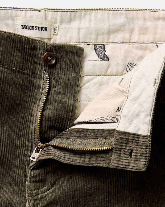 material shot of the zipper on The Carnegie Pant in Fatigue Olive Corduroy