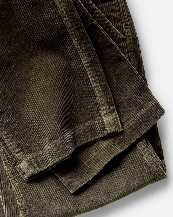 material shot of the hem on The Carnegie Pant in Fatigue Olive Corduroy
