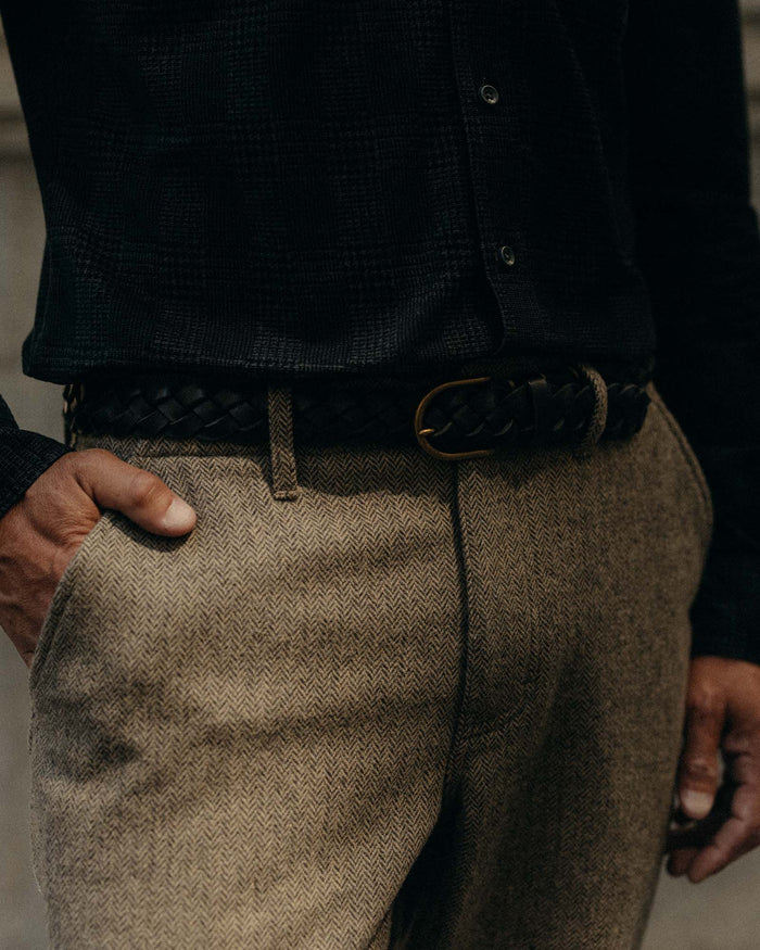 fit model showing off the pockets on The Carnegie Pant in Gravel Herringbone Wool