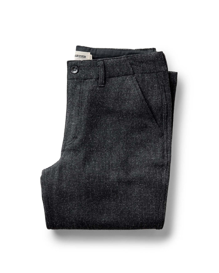 folded flatlay of The Carnegie Pant in Heather Charcoal Wool
