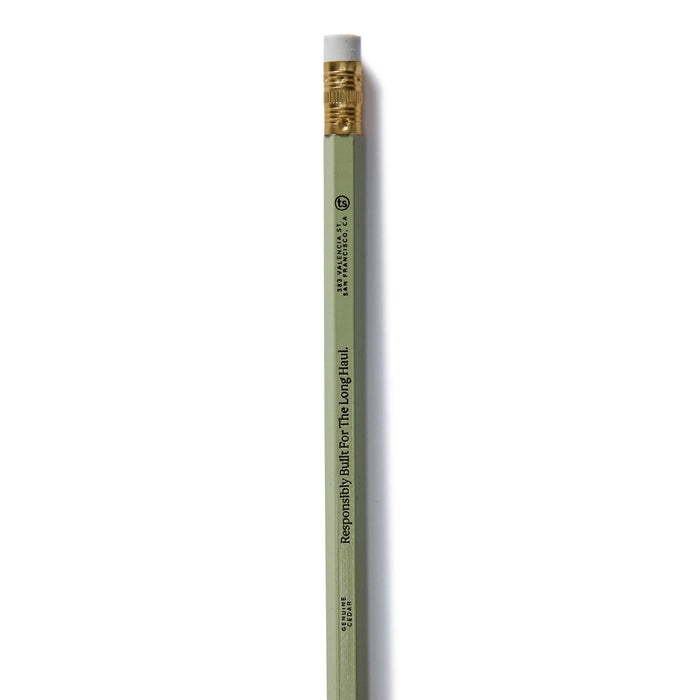 flatlay of the green version of The Cedar Hex Pencil (12-Pack)