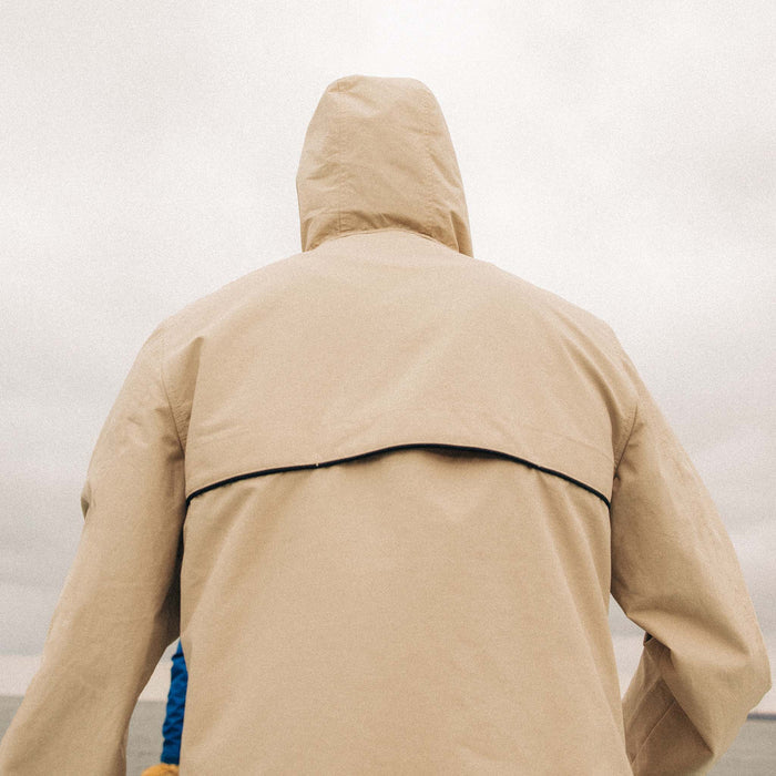 fit model showing off the back of The Chapman Anorak in Light Khaki