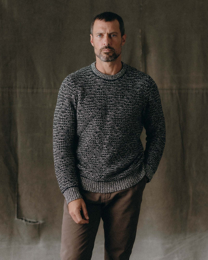 fit model with his hand in his pocket wearing The Chatham Crew in Marine Stripe Jacquard