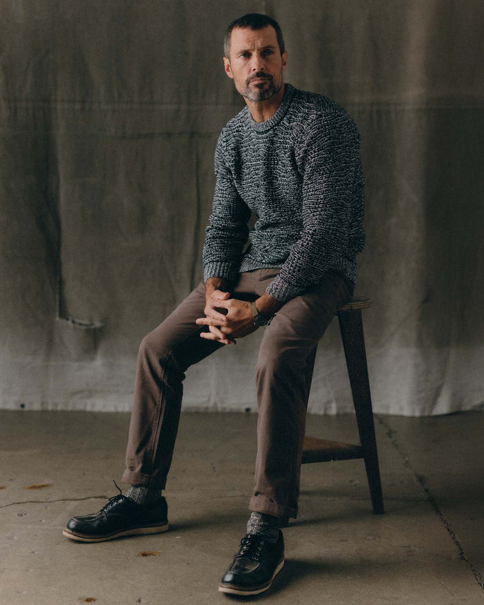 fit model sitting wearing The Chatham Crew in Marine Stripe Jacquard