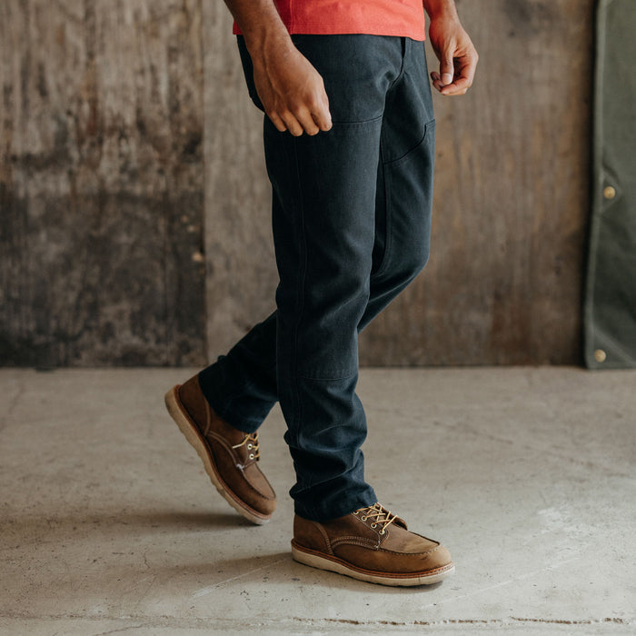 fit model walking in The Chore Pant in Coal Boss Duck