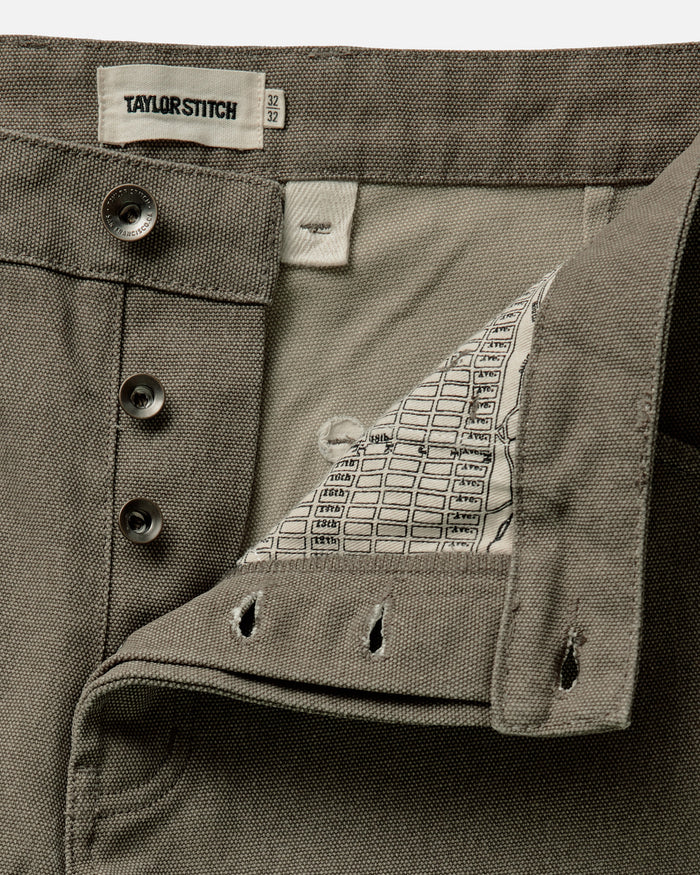 material shot of the button fly on The Chore Pant in Stone Chipped Canvas