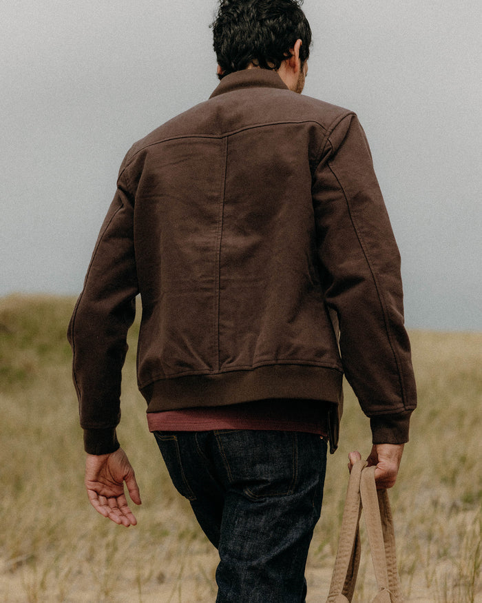 fit model showing off the back of The Clark Bomber in Soil Moleskin