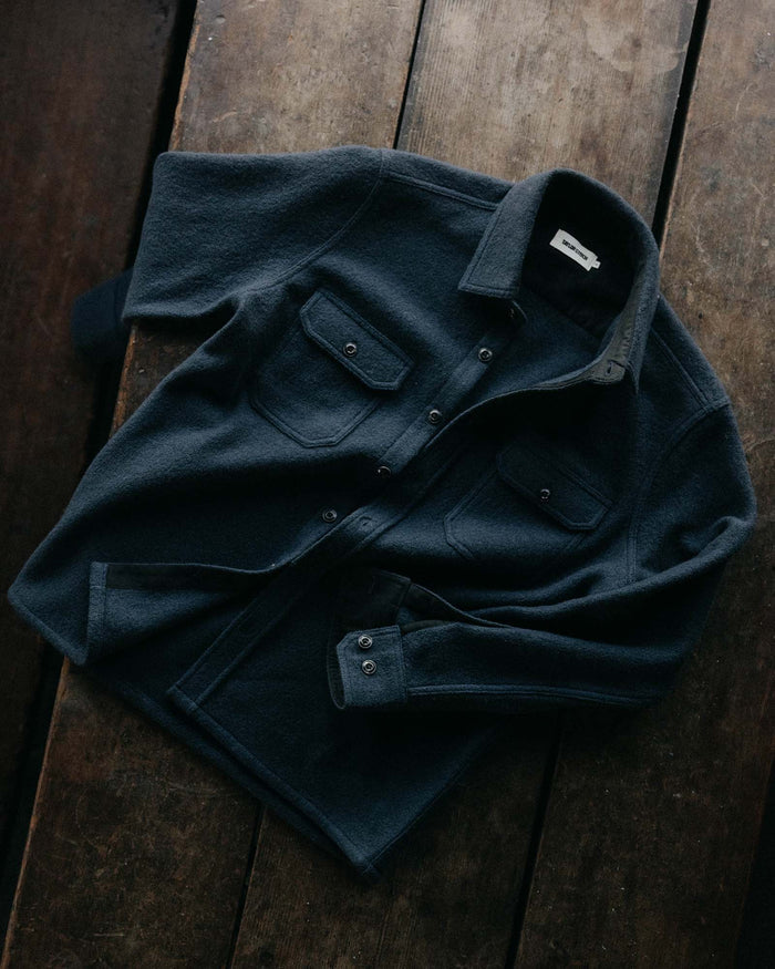 fit model showing off the buttons on The Connor Overshirt in Dark Navy Boucle
