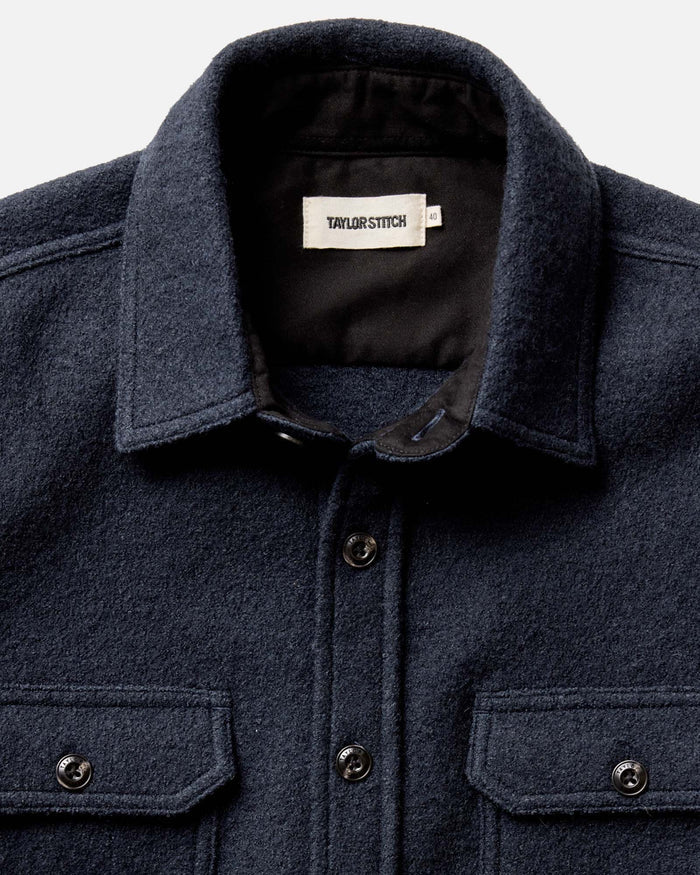 editorial image of The Connor Overshirt in Dark Navy Boucle hanging