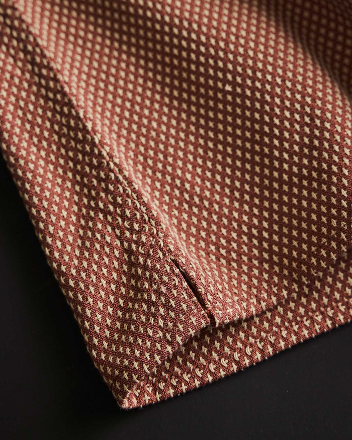 material shot of the hem on The Conrad Shirt in Fired Brick Dobby