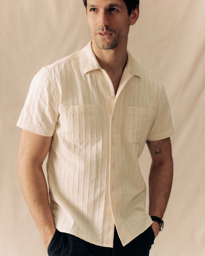 fit model posing in The Conrad Shirt in Vintage White Dobby Stripe