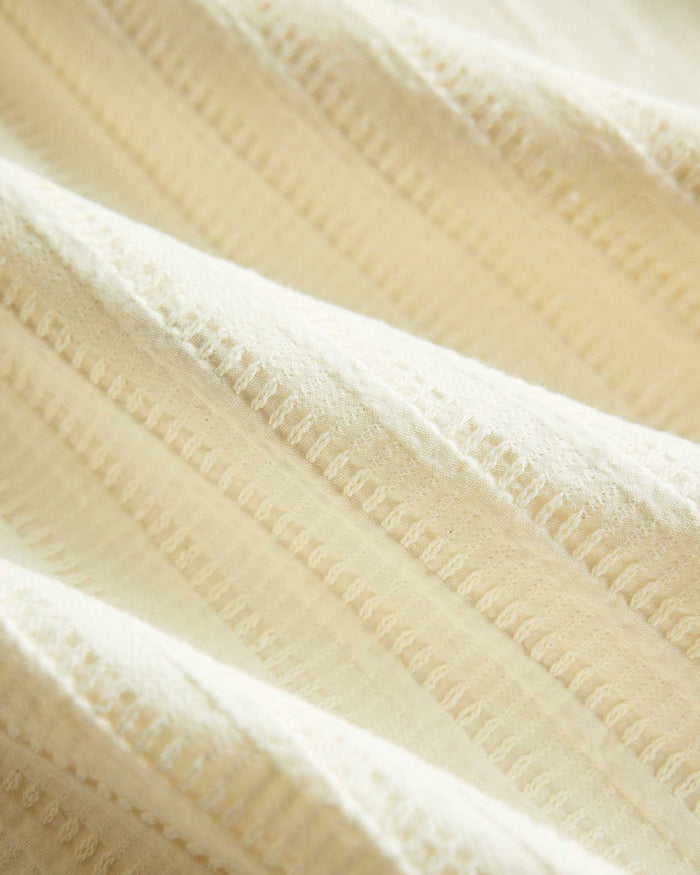 editorial image of the fabric on The Conrad Shirt in Vintage White Dobby Stripe