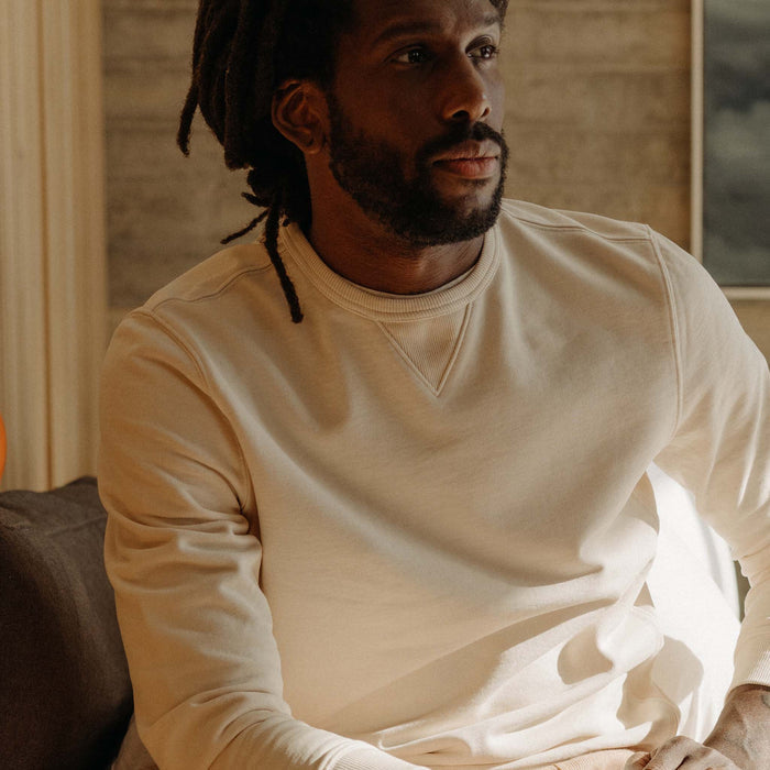 fit model sitting in The Cotton Hemp Crew in Natural