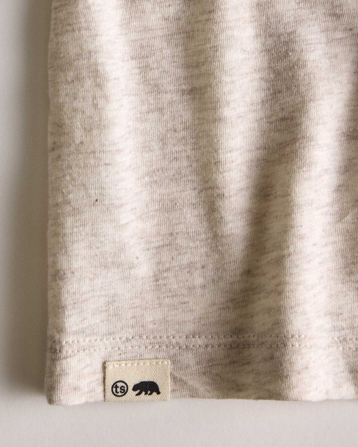 fit model showing the hem on The Cotton Hemp Long Sleeve Tee in Heathered Oat