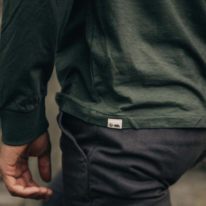 fit model showing off the logo on The Cotton Hemp Long Sleeve in Pine