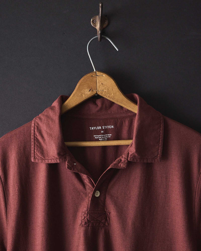 editorial image of The Cotton Hemp Polo in Black Cherry hanging