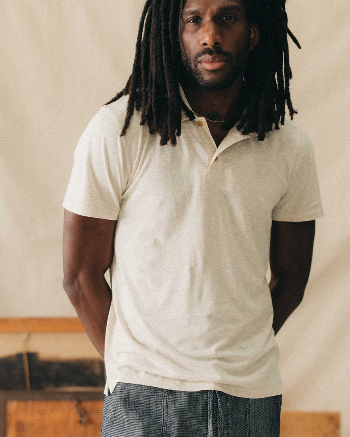 fit model walking wearing The Cotton Hemp Polo in Heather Oat