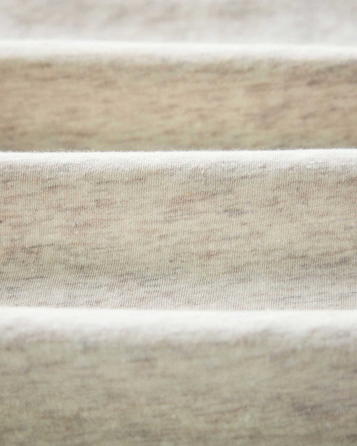 material shot of the logo on The Cotton Hemp Polo in Heather Oat
